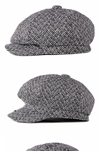 Detailed views of vintage black and white herringbone tweed newsboy cap for winter