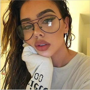 Classic black thin metal aviator glasses with double bridge shown on a female model