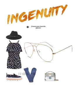 Fashionable aviator gold metal glasses styled with trendy black hat and chic accessories
