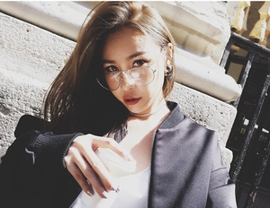 Detail of silver aviator glasses with double bridge and clear lenses on model