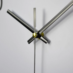 Modern 14-inch minimalist wall clock with matte black hands and gold center axis