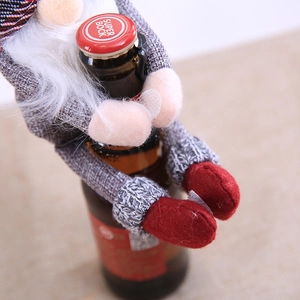 Christmas gnome wine bottle cover with grey fabric, white beard and red felt accents