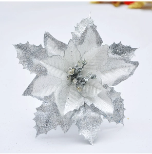Close-up of a silver artificial Christmas flower with glitter details for tree decoration