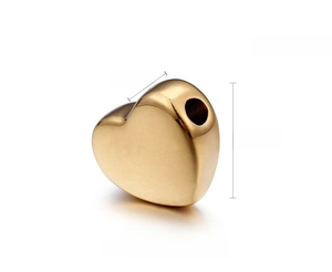 Macro detail of 18K gold plated heart bead with 5mm x 10mm size and 3g weight
