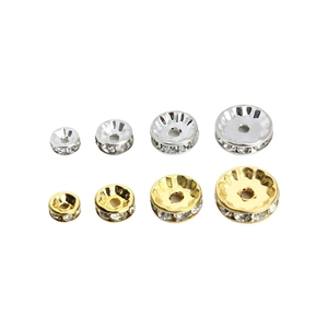 Macro view of gold and silver rhinestone spacer beads in four different diameters