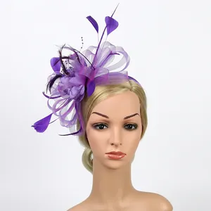 Detail of purple fascinator hat with elegant mesh flower feathers and beaded accents