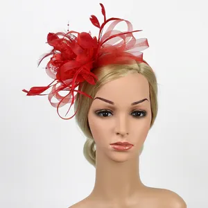 Detail of red feather fascinator hat with mesh flowers on a blonde mannequin head