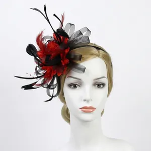 Detail of red and black feather fascinator with mesh flower on a mannequin head