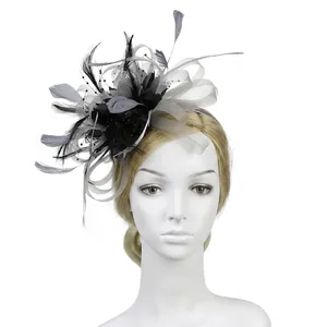 Detailed close-up of vintage feather fascinator with mesh netting and bead accents