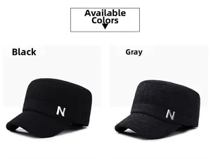 Detail view of winter flat top military caps in black and grey with side N embroidery