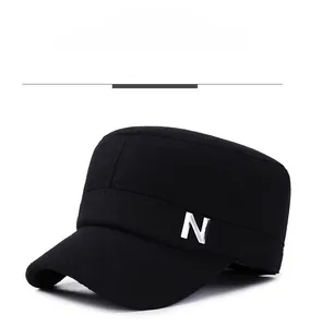 Close-up of silver metal buckle on black winter flat cap for elderly men