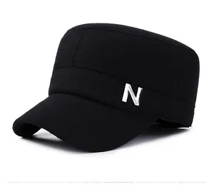 Close-up of a black winter flat top military cap with thick thermal wool and N metal detail