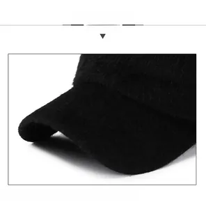 Close-up of black plush winter cap with SPORT embossing and reinforced visor structure