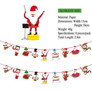 Detail of Christmas paper banner showing Santa and snowmen playing musical instruments