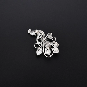 Elegant peacock feather brooch in silver finish with pavé rhinestones and secure pin back