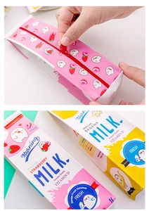 Detail view of pink strawberry and yellow banana milk carton pencil cases with zippers