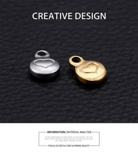 Macro detail of round stainless steel heart charms in gold and silver for DIY jewelry