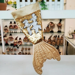 Sparkling gold and silver sequin mermaid tail Christmas stocking for holiday decoration