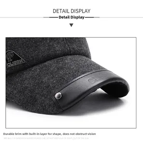 Close-up of wool baseball cap with leather brim edge and metallic logo detail