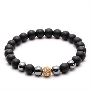 Detail of 8mm volcanic stone beads with a gold micro-pave zircon ball and tiger eye beads