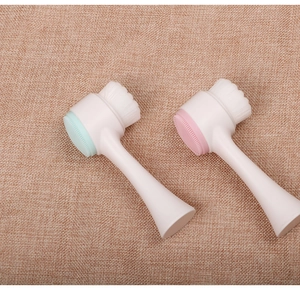 Close-up of dual-sided silicone facial brushes with soft bristles and ergonomic handles