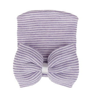 Detailed knit texture of newborn hospital hat with purple striped bow decoration