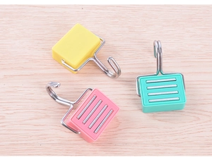 Detailed view of colorful magnetic hooks showing front side and magnetic back strip