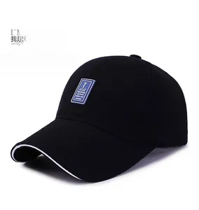 Detailed side view of black baseball cap with white piping and blue GOLF emblem
