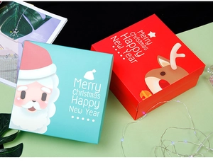Macro view of Christmas gift boxes with festive reindeer and Santa Claus illustrations