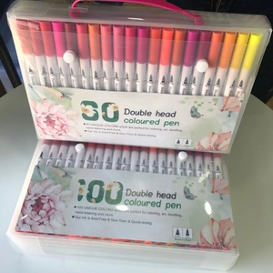 Detailed view of dual-tip markers in 60 and 100 color sets with transparent carrying cases