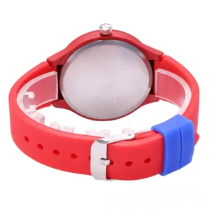 Rear view of the red silicone watch strap with a blue loop and stainless steel back