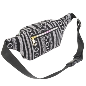Detail of bohemian waist bag with black and white geometric patterns and gold zipper