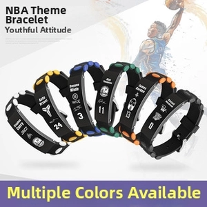 Macro shot of NBA star silicone wristbands with embossed team logos and numbers