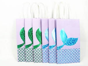 Detail view of 6 holographic mermaid tail gift bags with scale patterns and rope handles