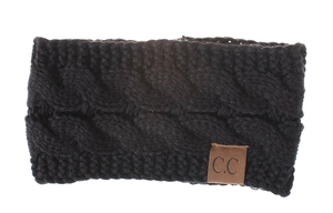 Detail of black cable knit ear-warmer headband with signature C.C leather brand patch