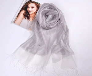 Detail of silver-grey silk organza scarf with shimmering gold silk and fringe tassels