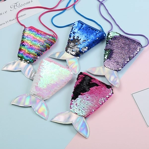 Detail of five mermaid tail sequin coin purses with adjustable shoulder straps