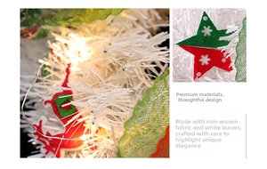 Detail of white Christmas wreath with red felt ornaments and LED string lights