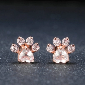 Creative rose gold cat paw stud earrings featuring pink heart-shaped cubic zirconia crystals