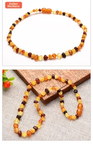 Detailed close-up of multi-colored Baltic amber beads with a secure screw clasp