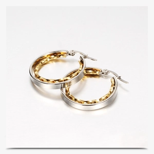 Detail of 28mm dual-tone hollow stainless steel earrings with gold twisted inner ring