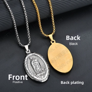 Macro detail of oval relief pendant necklace showing Virgin Mary engraving and smooth back