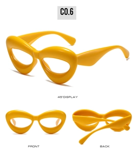 Detailed views of chunky yellow cat-eye glasses with thick frames from three angles