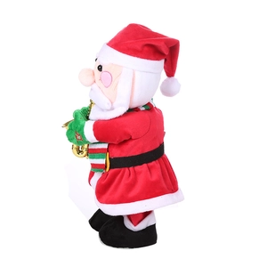 Detail of Santa Claus plush toy holding a golden saxophone for Christmas decoration