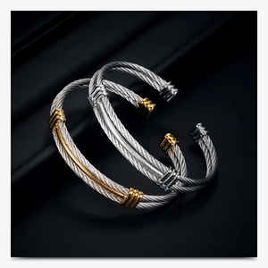 Detailed view of 10mm woven cable bracelets in gold and silver finish with metal rings