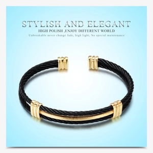 Detail of 10mm woven stainless steel bracelet in black and gold polished finish