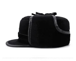 Side view of men's winter faux fur trapper hat with warm earflaps and leather trim