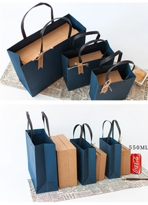 Three sizes of dark blue paper gift bags with handles and kraft paper inner boxes