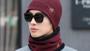 Macro view of men's knit beanie and neck warmer set with warm black fleece lining
