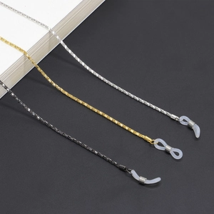 Three-color metallic eyewear chains in gold, silver, and black with silicone loop ends